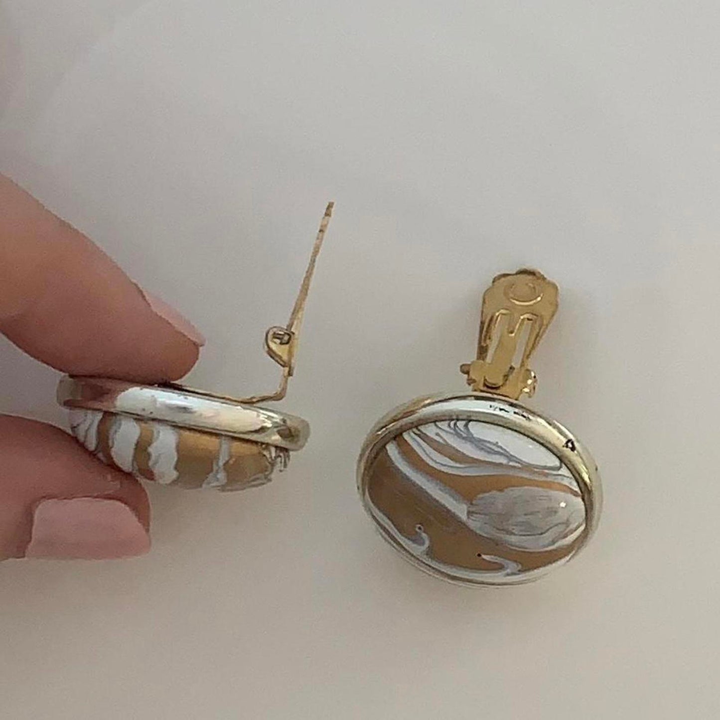 Vintage 1980s Clip on earrings with a Swirl design in bronze and white colours