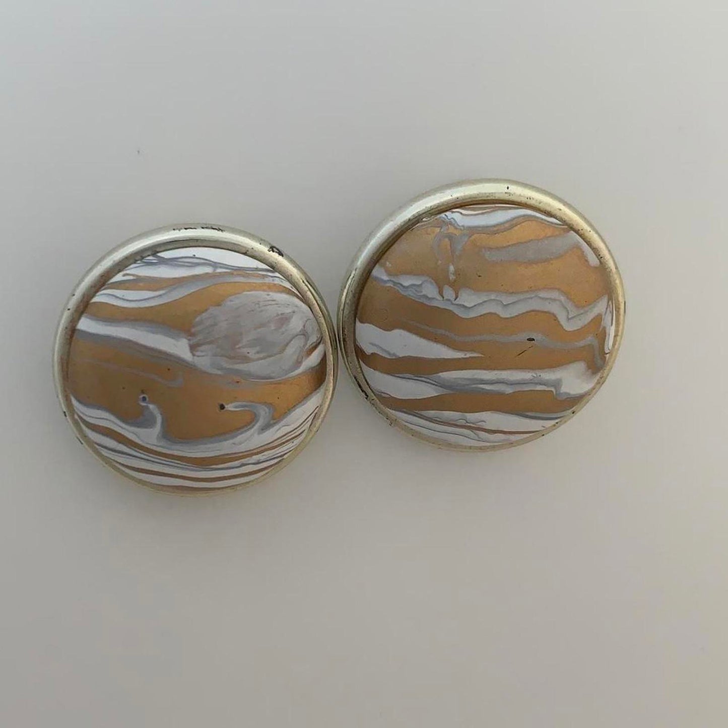Vintage 1980s Clip on earrings with a Swirl design in bronze and white colours