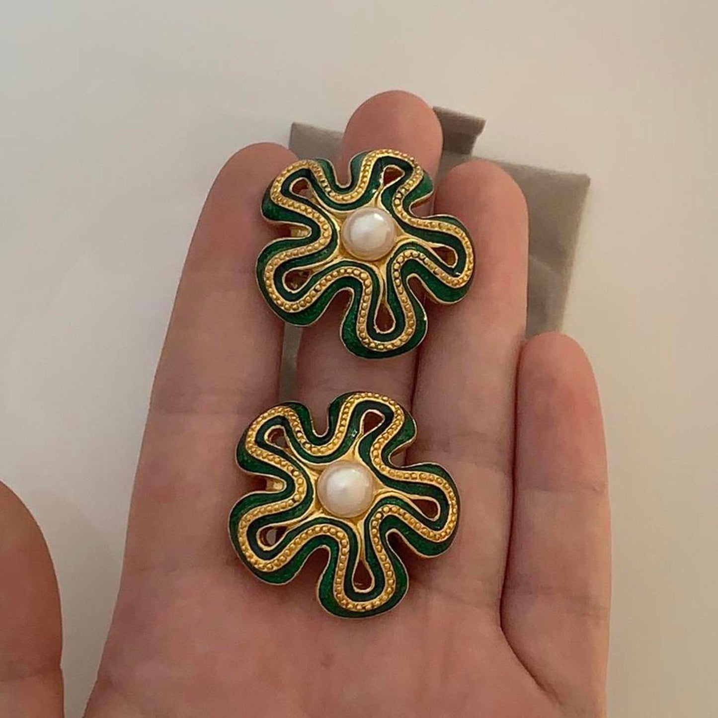 Soleil Vintage Clip on earrings featuring green enamel and faux pearls